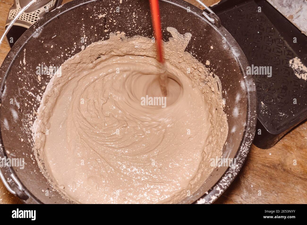 preparing a mortar plaster stirring mix water consistency emulsion