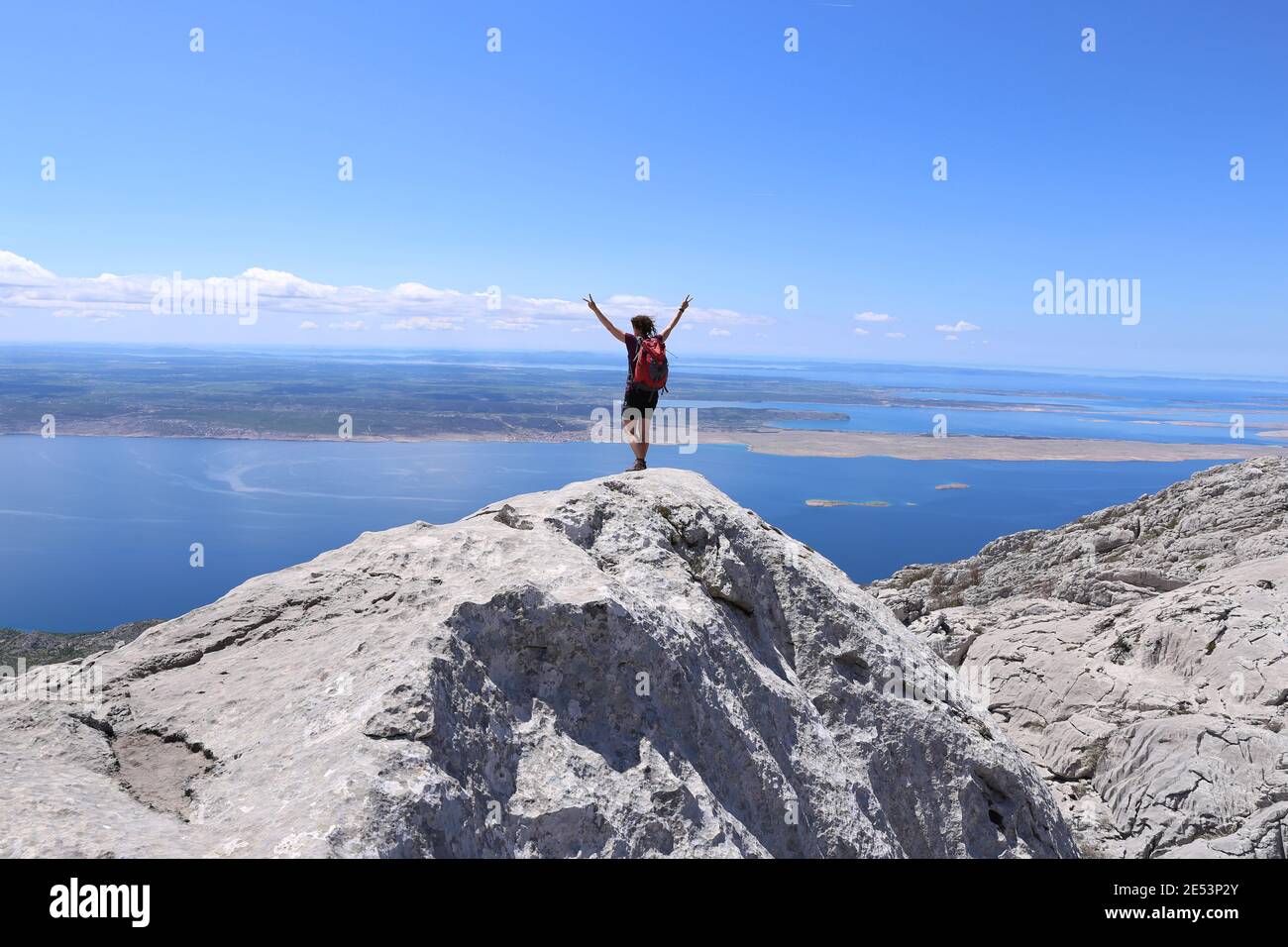 Woman is standing on the summit and feel free Stock Photo