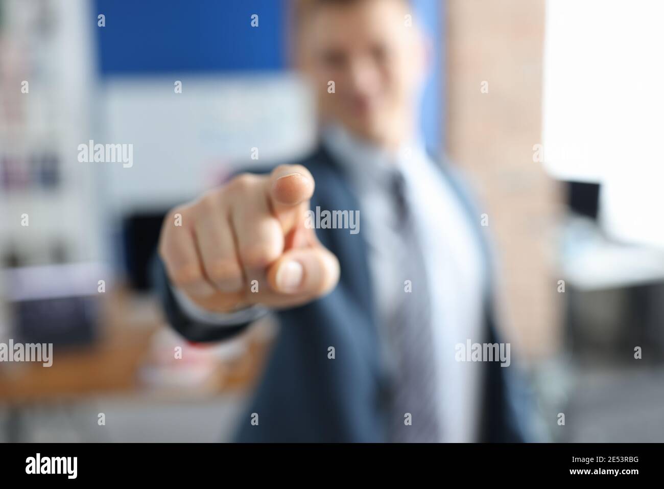 Man in suit pointing forward hi-res stock photography and images - Alamy
