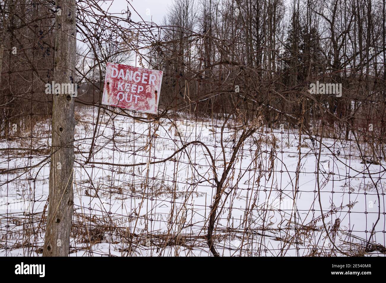 Closeup of the danger sign that says 'DANGER KEEP OUT' Stock Photo
