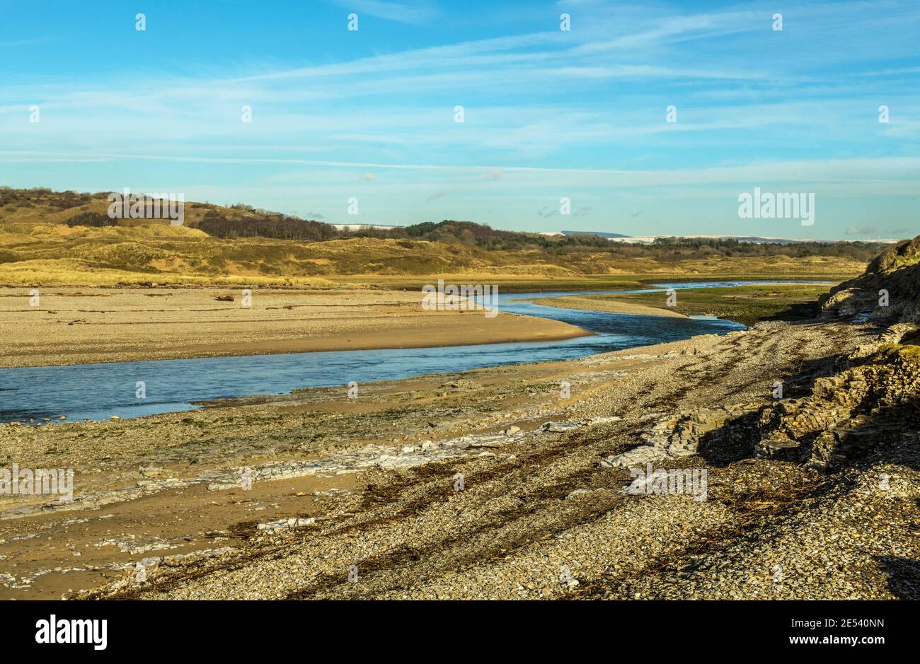 The River Ogmore at Ogmore by Sea heading out to sea, in the Vale of Glamorgan, south Wales on a sunny January day. Stock Photo