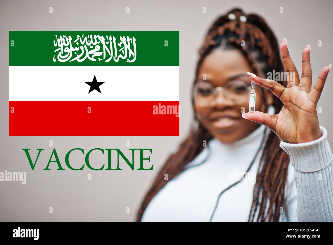 African woman show vaccine for Republic of Somaliland. Vaccination of Africa countries concept. Stock Photo