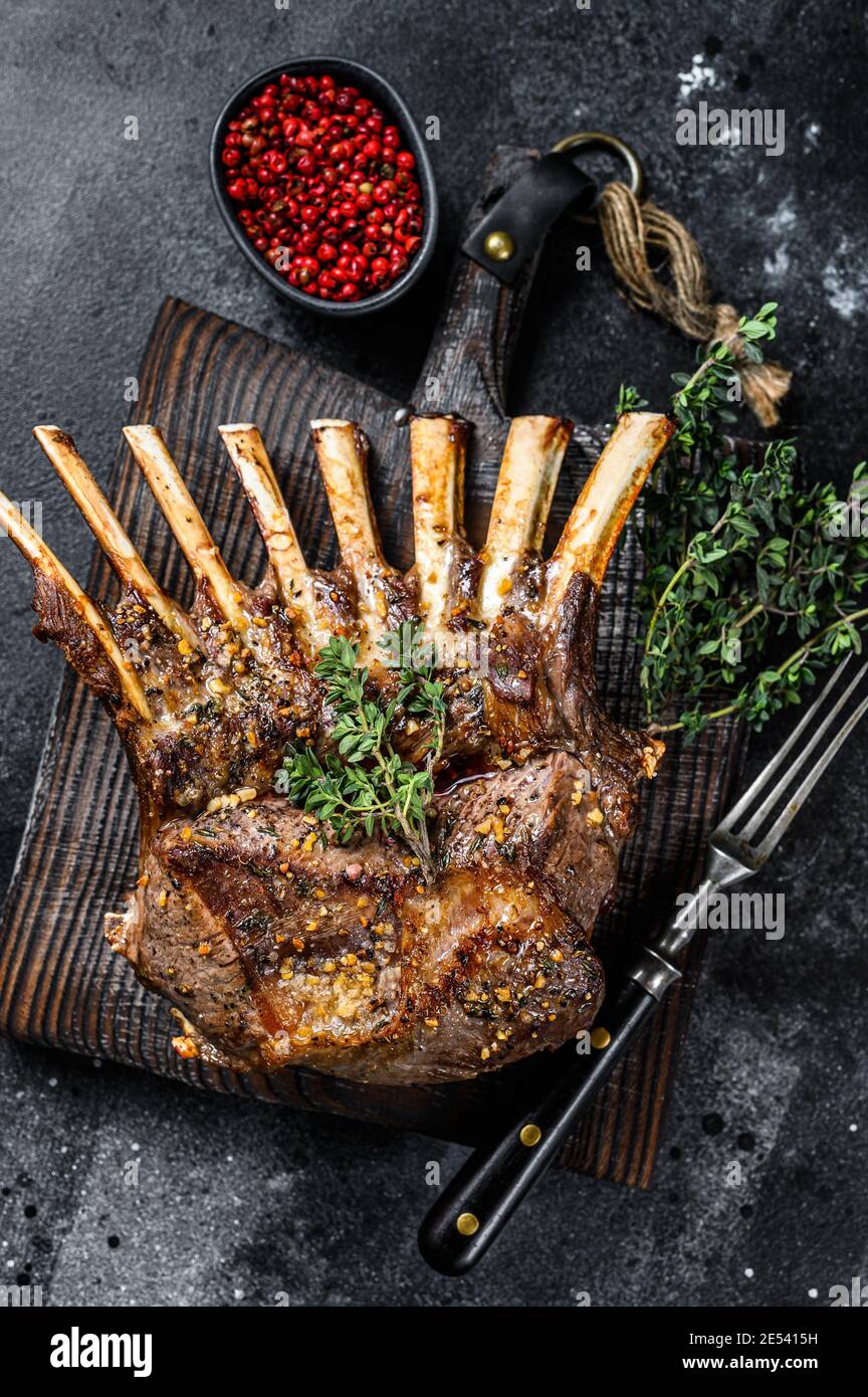 Barbecue rack of lamb meat chops. Black background. Top view Stock