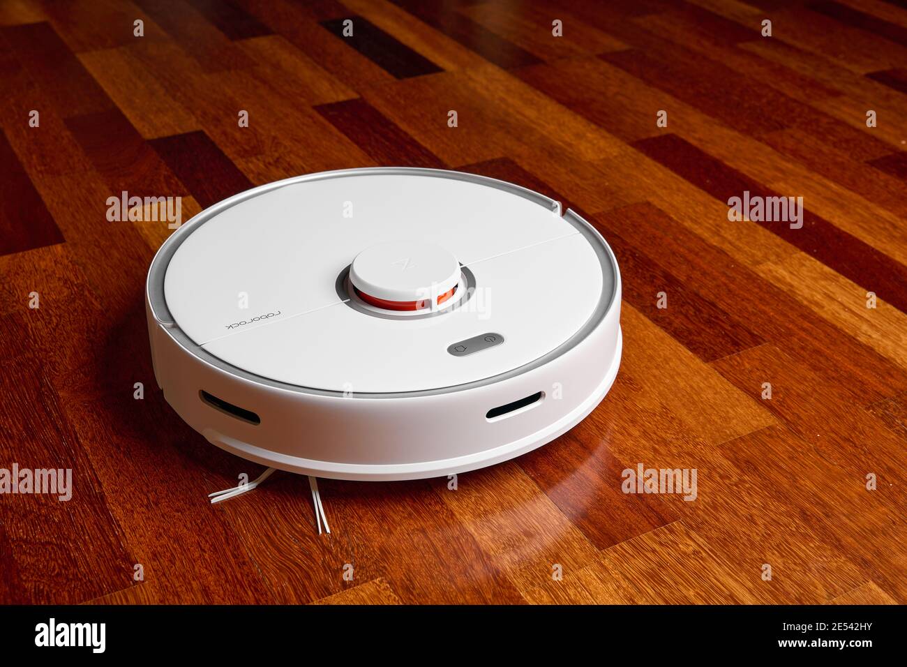 Smart Robot Vacuum Cleaner Xiaomi roborock s5 max on wood floor. Robot vacuum cleaner performs automatic cleaning of the apartment. 04.12.2020, Rostov Stock Photo