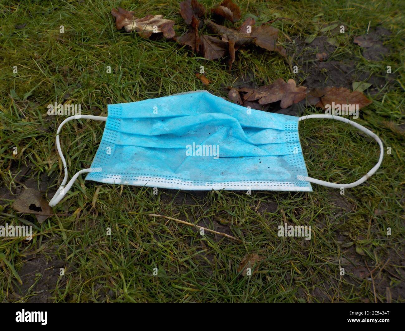 A Protective Mask Was Thrown Away Along The Way Stock Photo Alamy