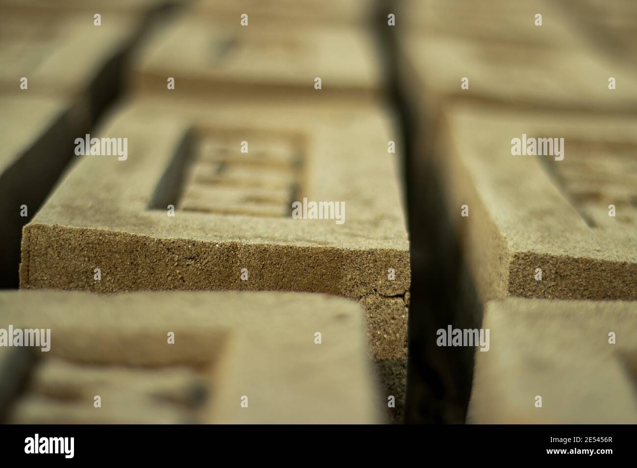 Raw Brick closeup Drying Up Raw Bricks and block used to build walls Stock Photo