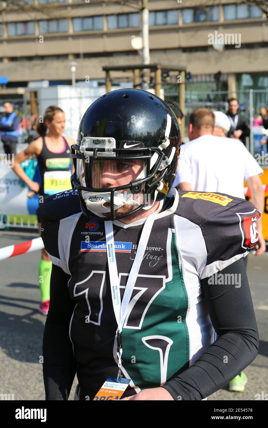 Portrait of Smiling Woman in American Football Uniform and Helmet