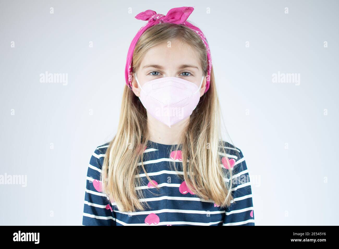 Infection concept. Portrait of little girl wearing medical mask over ...