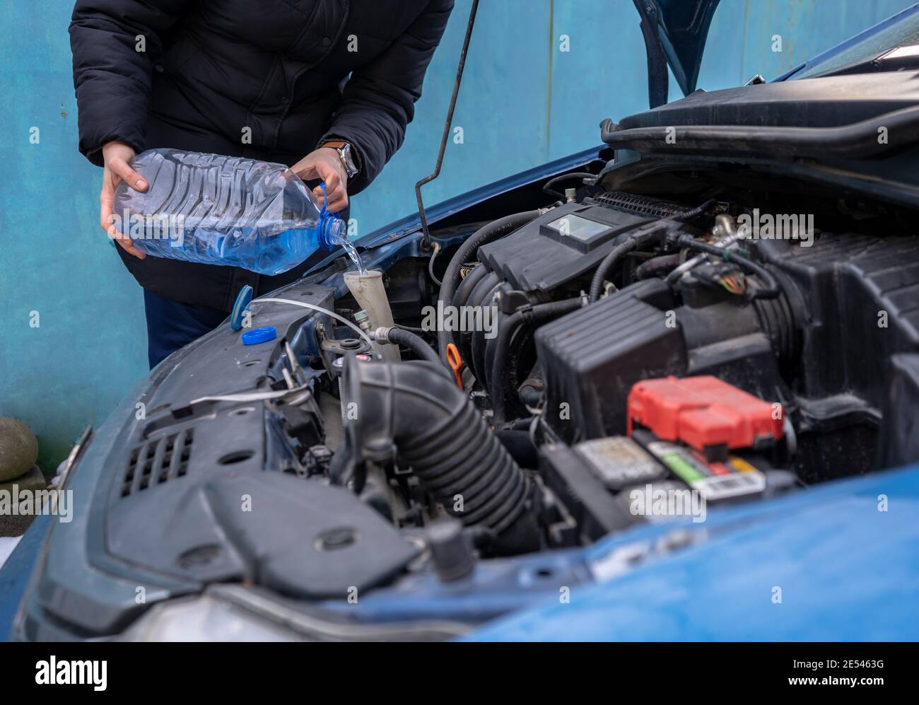 pouring antifreeze into special fluid tank Stock Photo Alamy