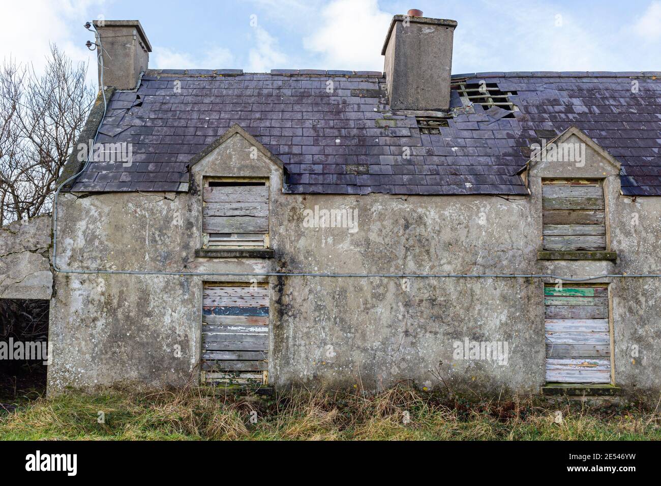 Old abandoned house with boarded up windows and doors, County Kerry, Ireland Stock Photo