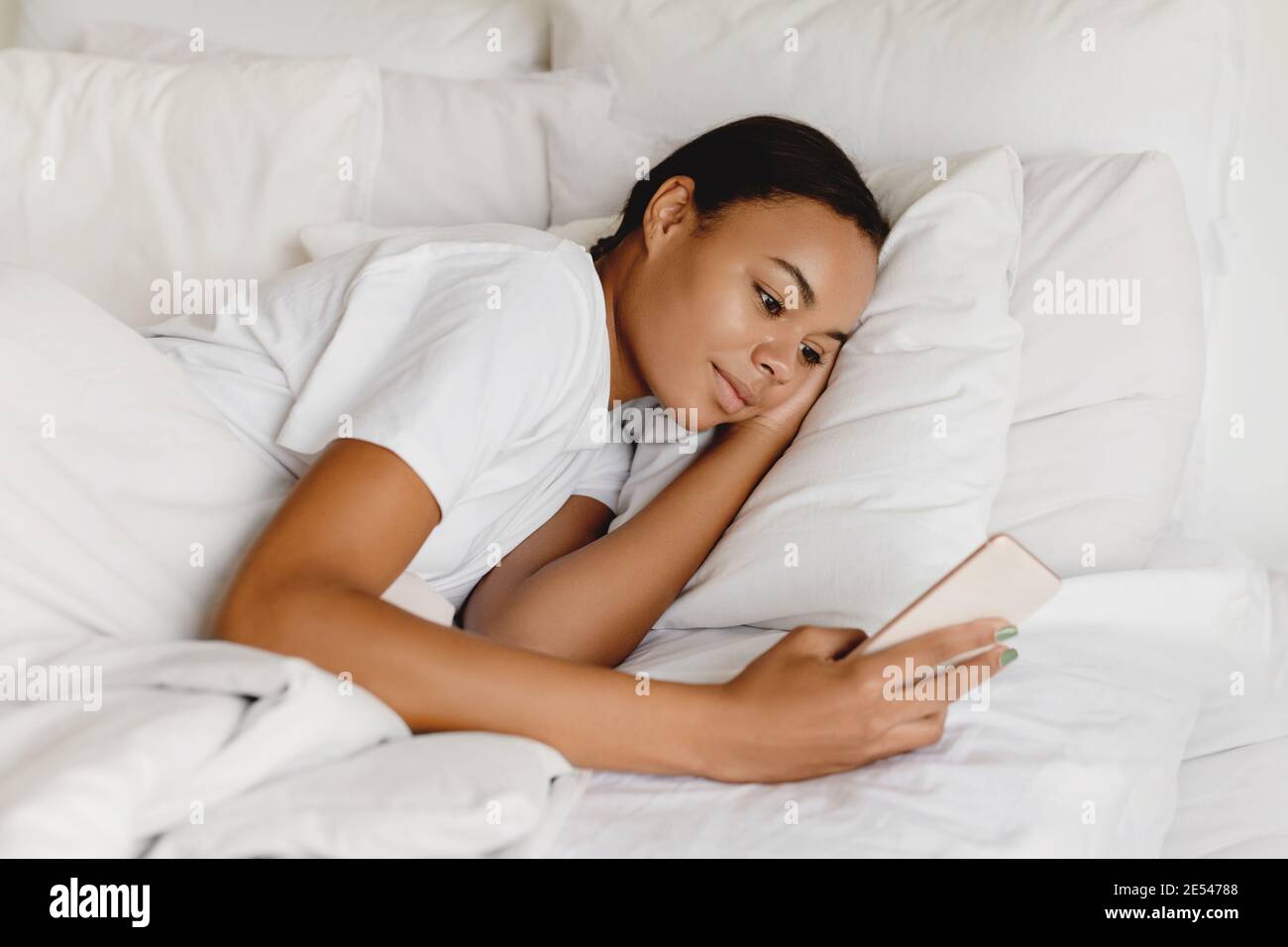 African woman sleeping on bed hi-res stock photography and images - Alamy