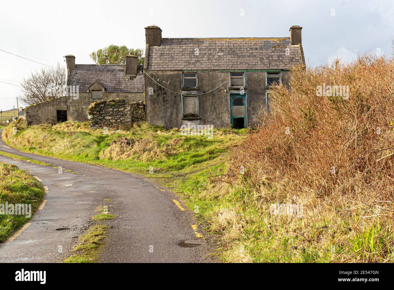 Old abandoned house with boarded up windows and doors, County Kerry