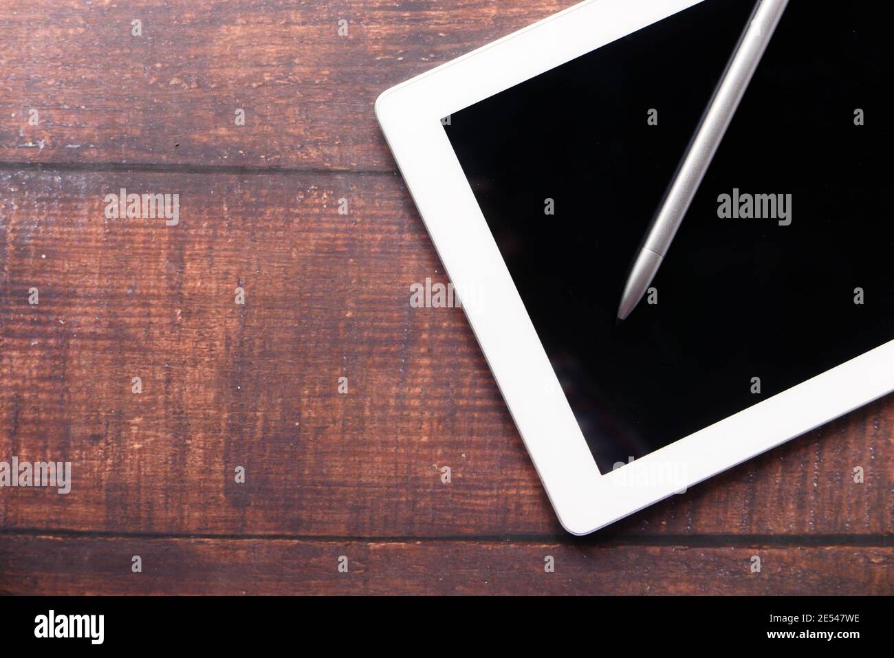 Flat composition of digital tablet and pen on table with copy space  Stock Photo