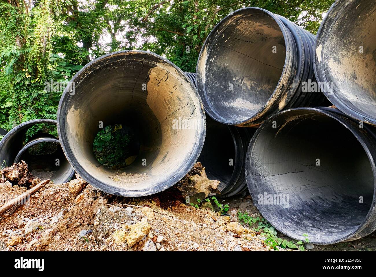 Piles of large pvc plastic pipes along the road side, used in a waste water rehabilitation project on Boracay Island, Philippines, Asia Stock Photo