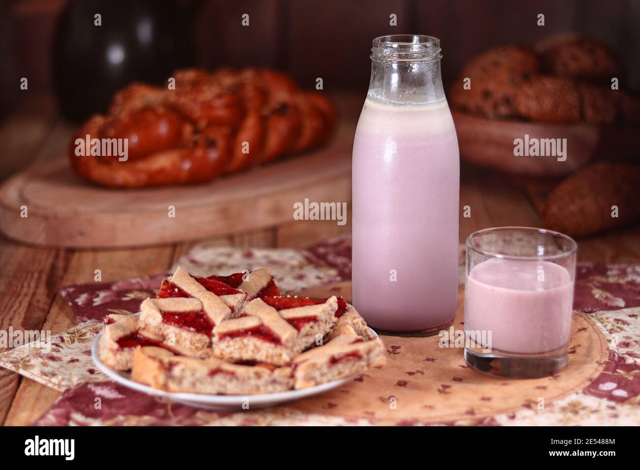 fruit milk drink in a bottle, glass, cake, still life Stock Photo