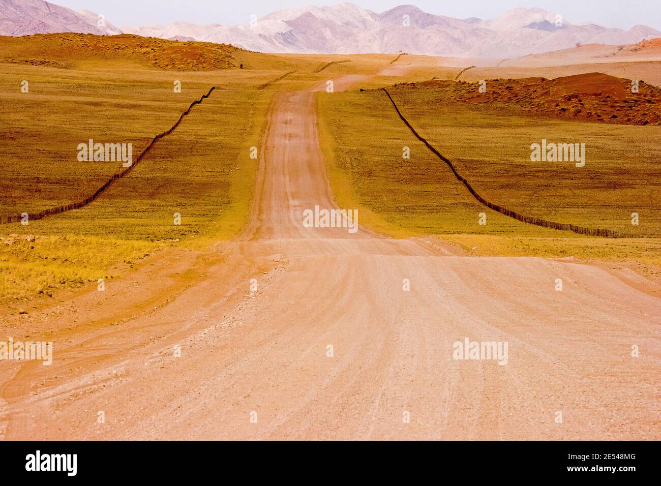 A gravel road in the picturesque landscape of Namibia. Stock Photo