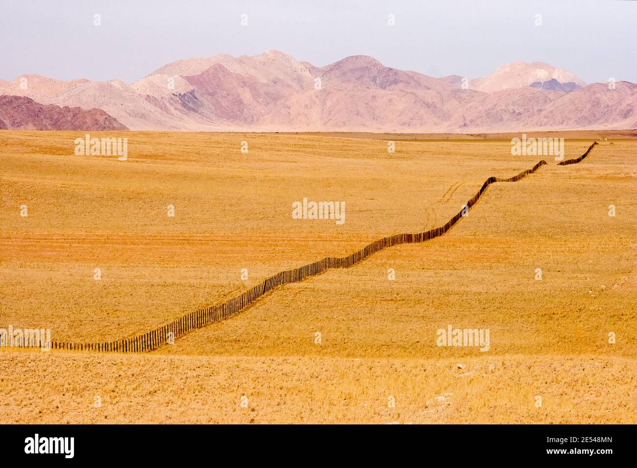 A gravel road in the picturesque landscape of Namibia. Stock Photo