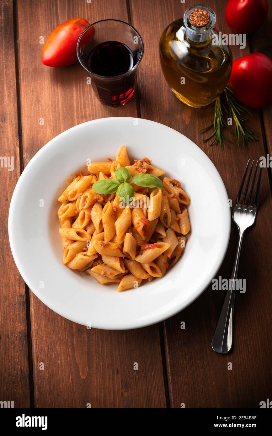Dish of mezze penne pasta with bolognese sauce, Italian cuisine Stock Photo