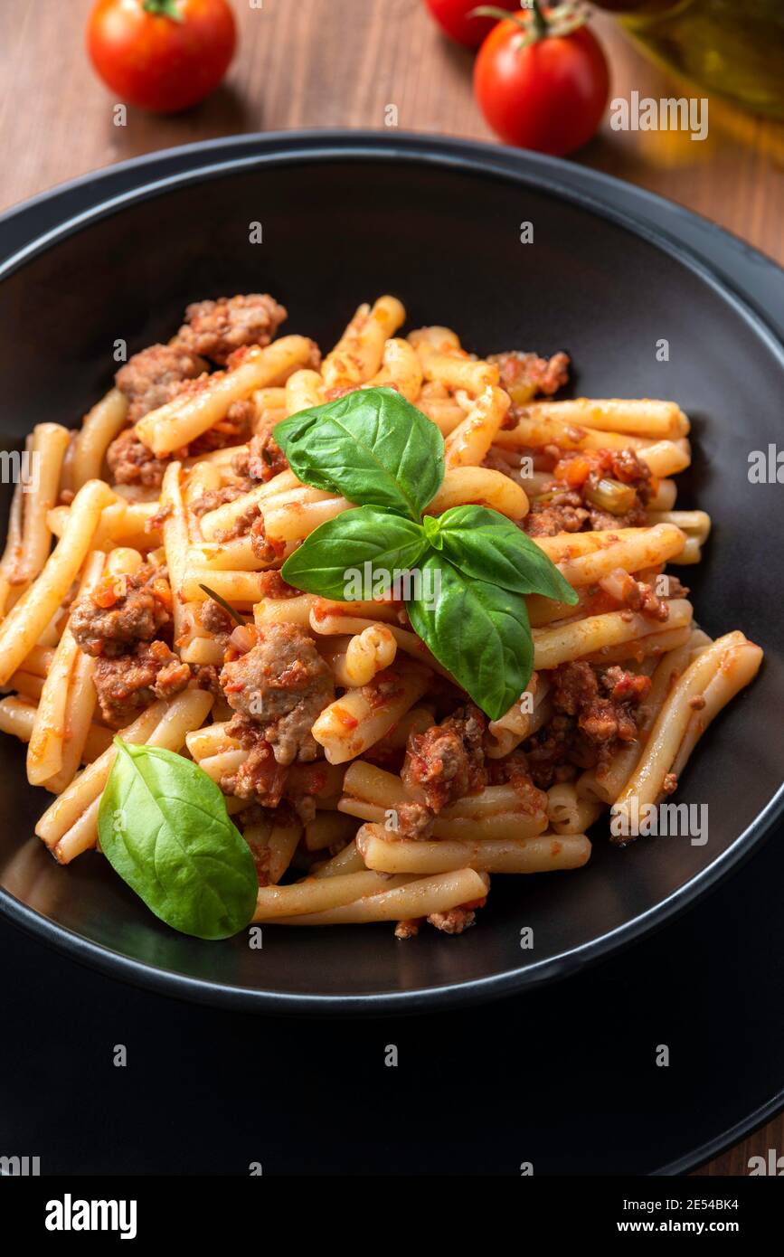 Dish of caserecce pasta with deliicious bolognese sauce, Italian Cuisine Stock Photo