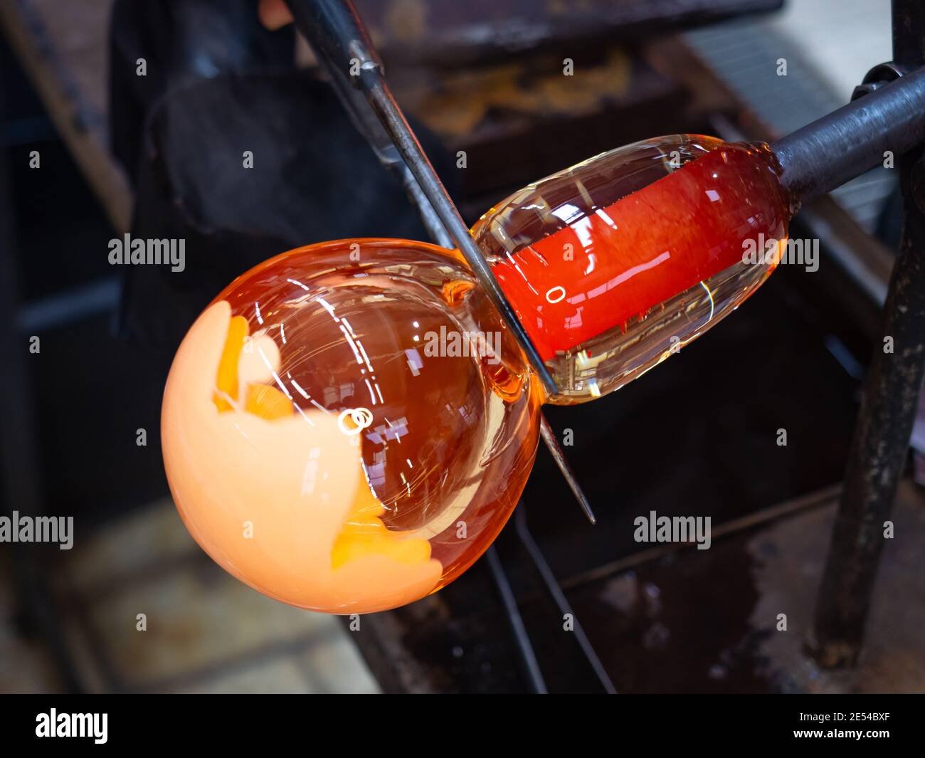 Glassworks glass manufacturing. Manual process of forming a decorative