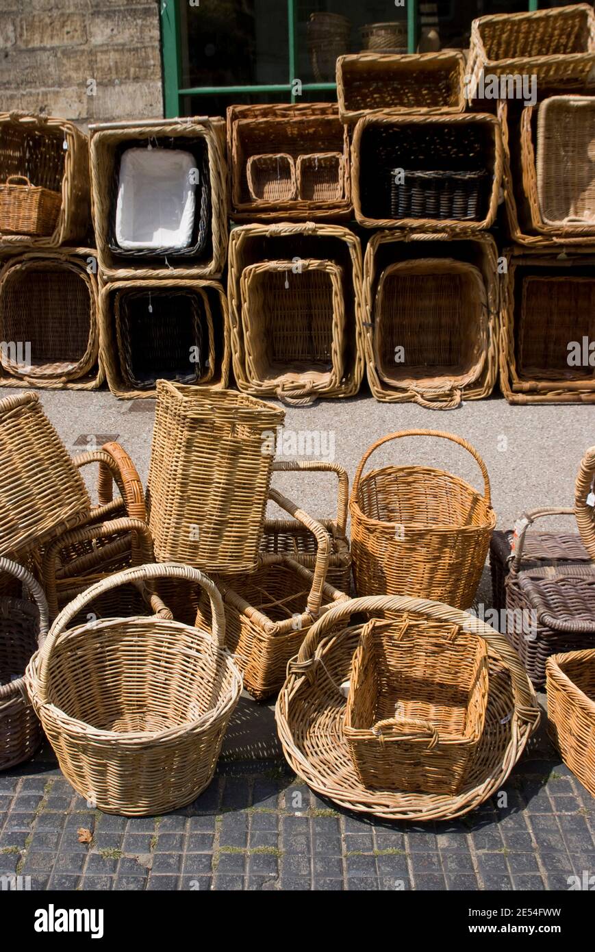 Baskets for sale on the pavement on the High Street, Burford