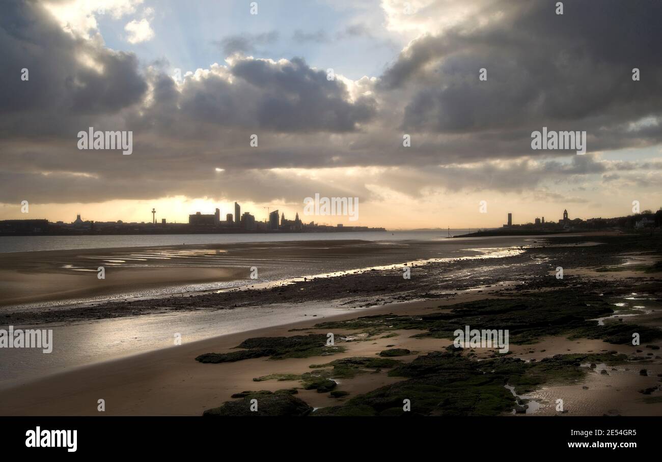 Low tide on a Merseyside beach with view to land, Liverpool, England, UK Stock Photo
