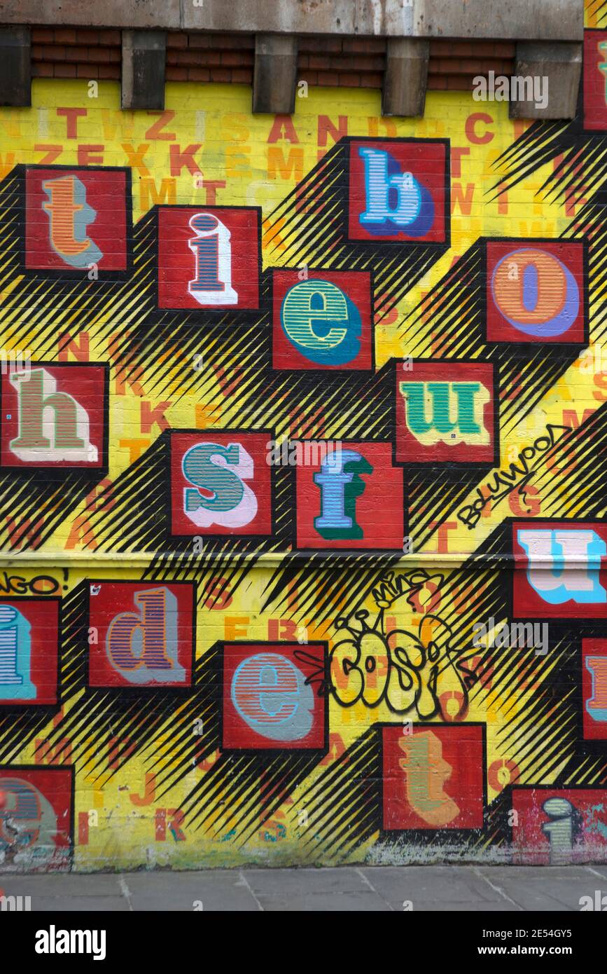 Ben Eine. Street art, large initials letters painted on metal scrolling