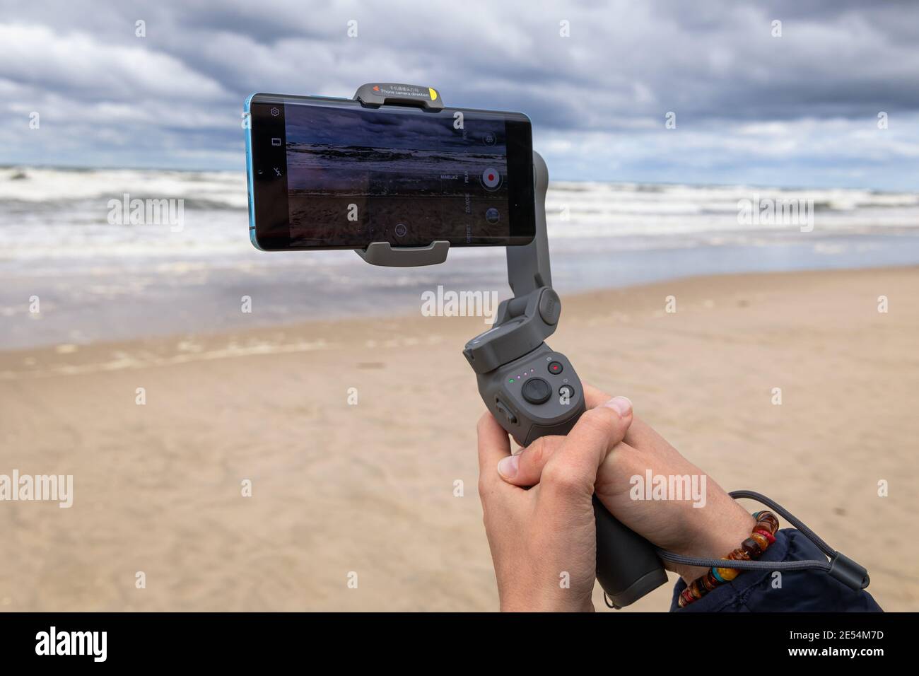 Making movie with DJI Osmo Mobile 3 gimbal with Huawei P30 PRO, Baltic sea  beach in Poland Stock Photo - Alamy