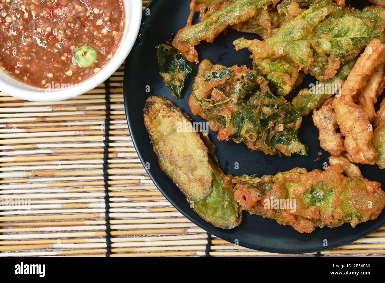 batter fried vegetable coating flour on plate dipping Thai spicy shrimp