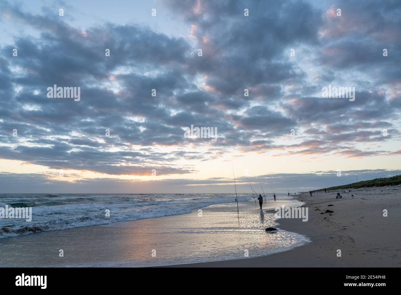 Beautiful shot of the sea under a cloudy sky at sunset Stock Photo - Alamy