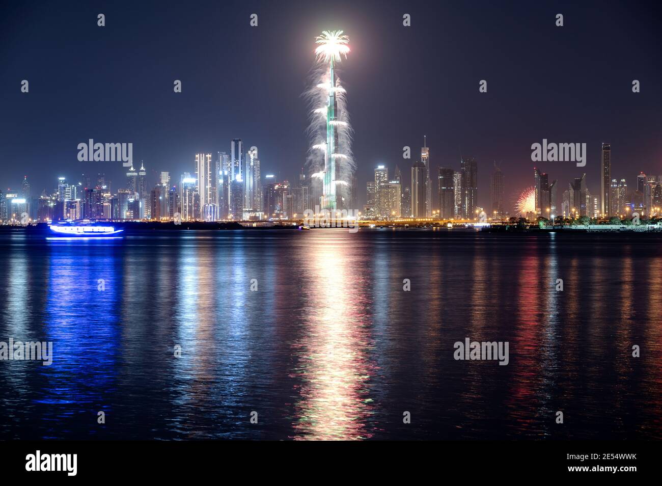 VIEW OF THE SPECTACULAR FIREWORKS  AT THE BURJ KHALIFA ILLUMINATED WITH THE UAE FLAG COLORS DURING THE NEW YEAR 2021 CELEBRATION FROM CREEK HARBOUR Stock Photo