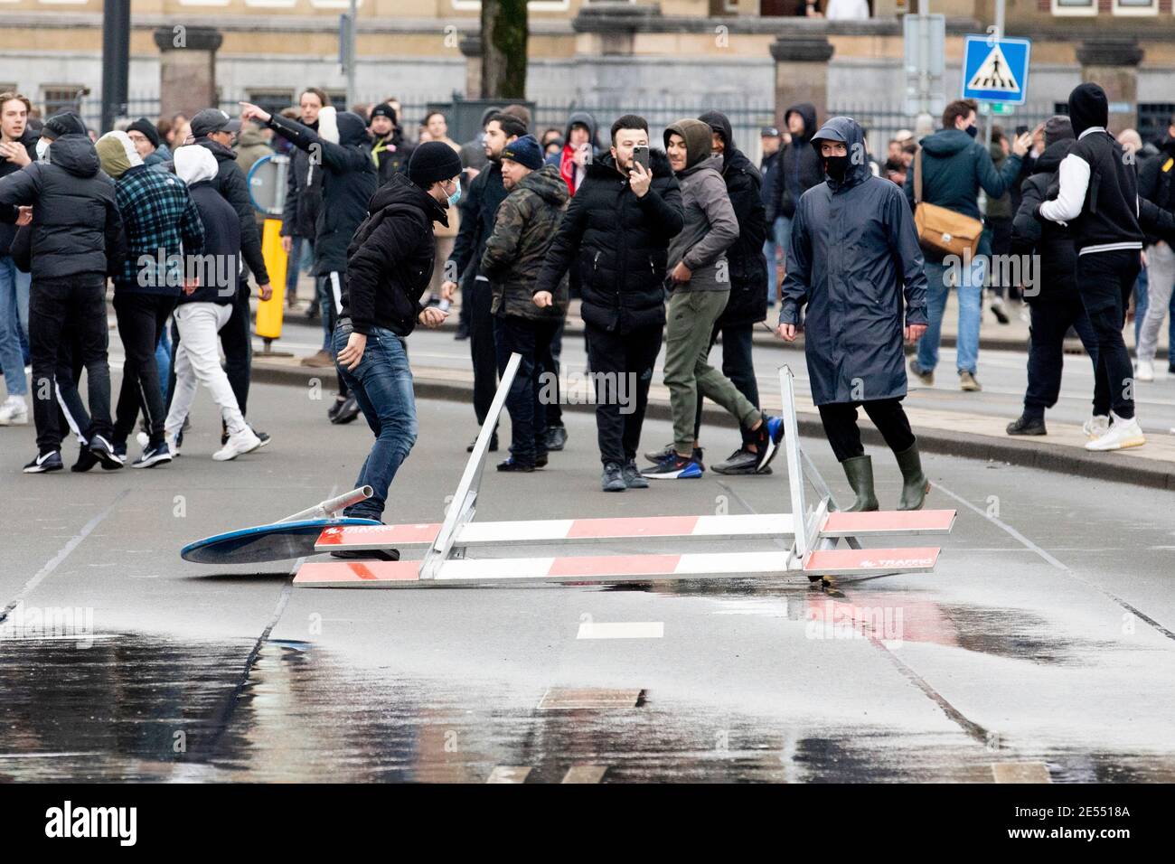 AMSTERDAM, NETHERLANDS, JANUARY 24: Protesters are seen clashing with riot police near the Museumplein on January 24, 2021 in Amsterdam, Netherlands. Stock Photo