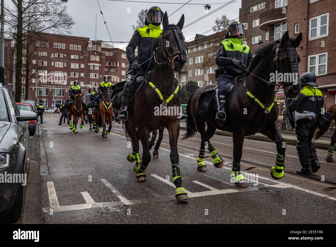 AMSTERDAM, NETHERLANDS, JANUARY 24: Riot police are seen near the Museumplein on January 24, 2021 in Amsterdam, Netherlands. Riots erupted after a for Stock Photo