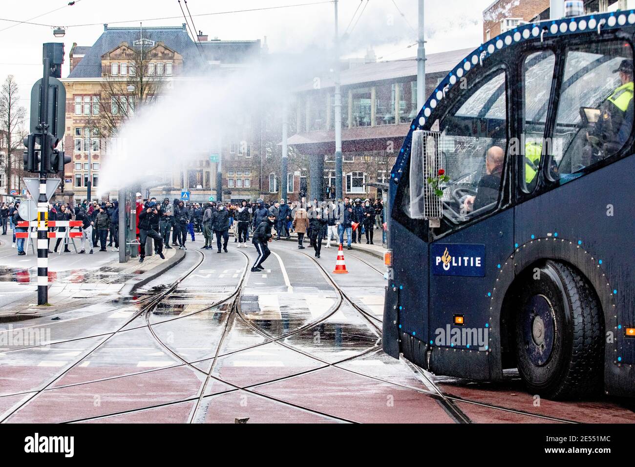 AMSTERDAM, NETHERLANDS, JANUARY 24: Riot police are seen clearing the area of protesters using a water canon near the Museumplein on January 24, 2021 Stock Photo