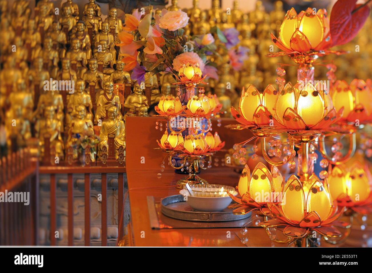 Gold buddhist statue in Longhua temple. Statues of the 500 Lohan Stock Photo