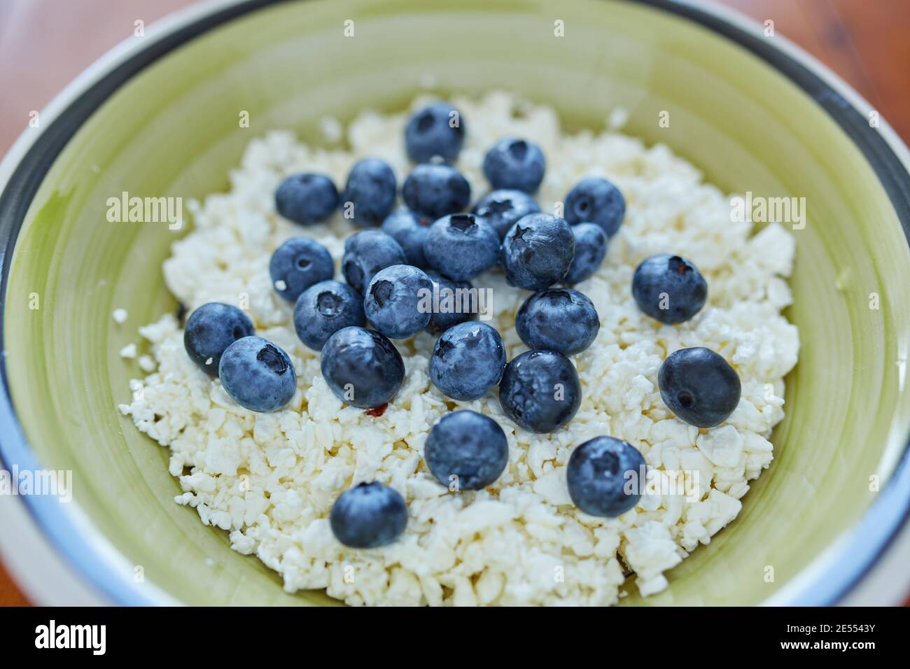 A bowl of cottage cheese with blueberries Stock Photo