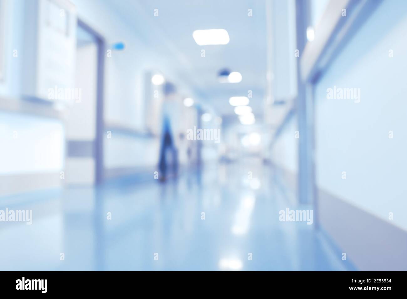 Male medical doctor in the bright hospital lobby, unfocused background. Stock Photo