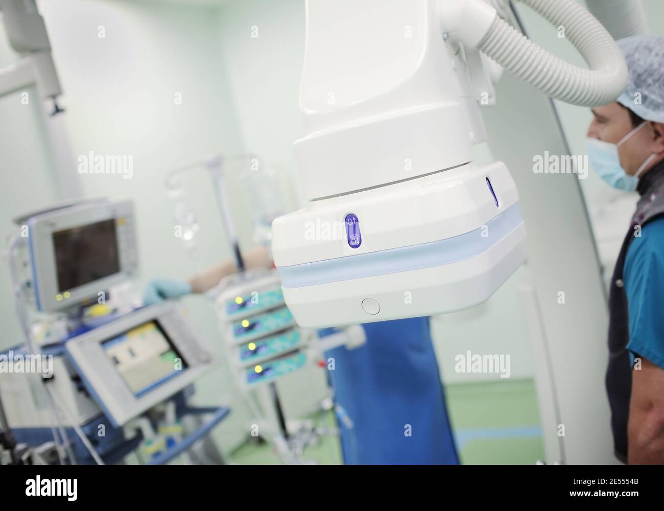 X-ray device at work in the laboratory with medical staff and equipment. Stock Photo