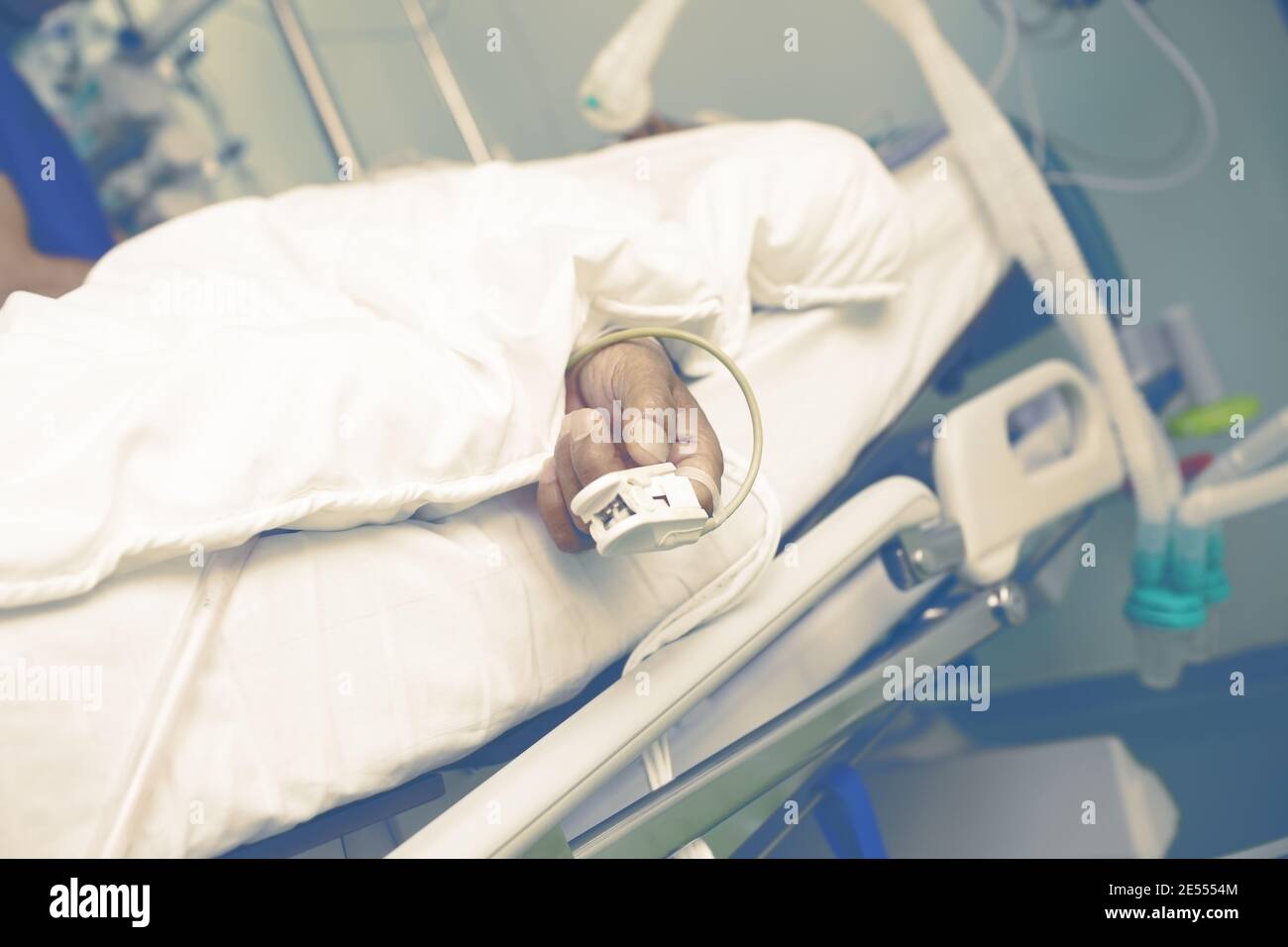 Life support of an old man in the ICU. Stock Photo