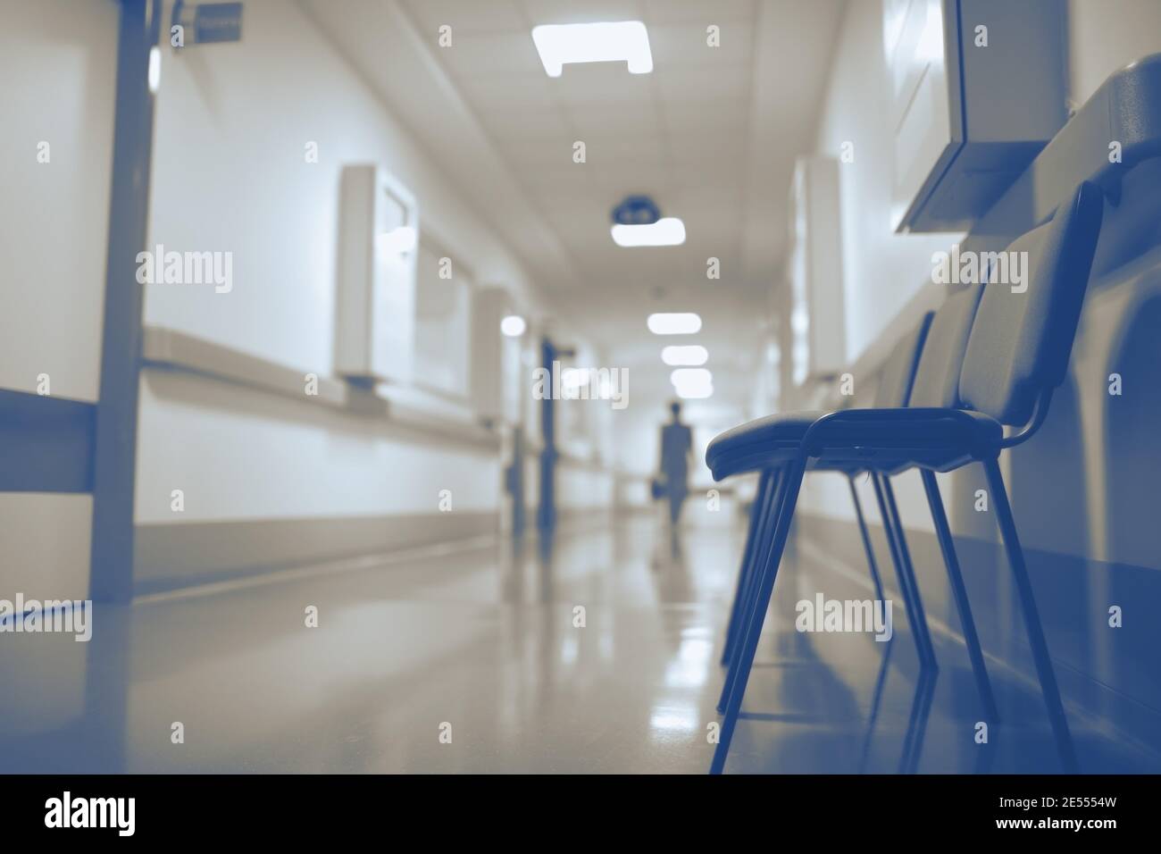 Figure walking away in the hospital corridor. Stock Photo