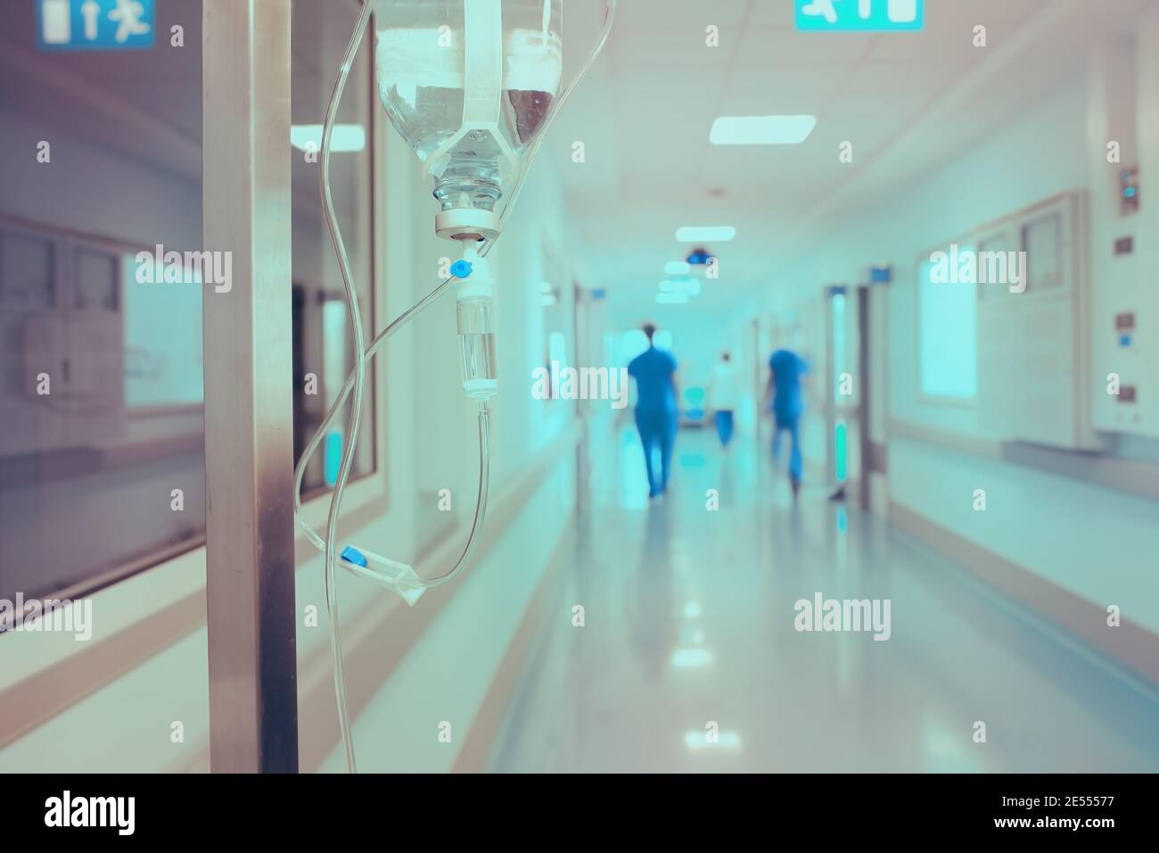 Walking medical workers in the hospital on the background of drip. Stock Photo