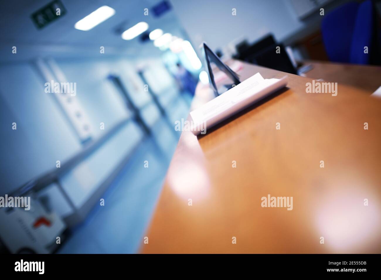 Hospital reception with blurred silhouette. Stock Photo