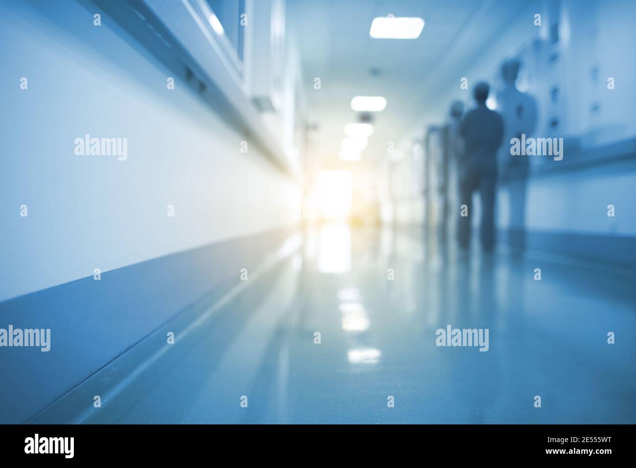 Doubled silhouette of medical worker in hospital hall, unfocused background. Stock Photo