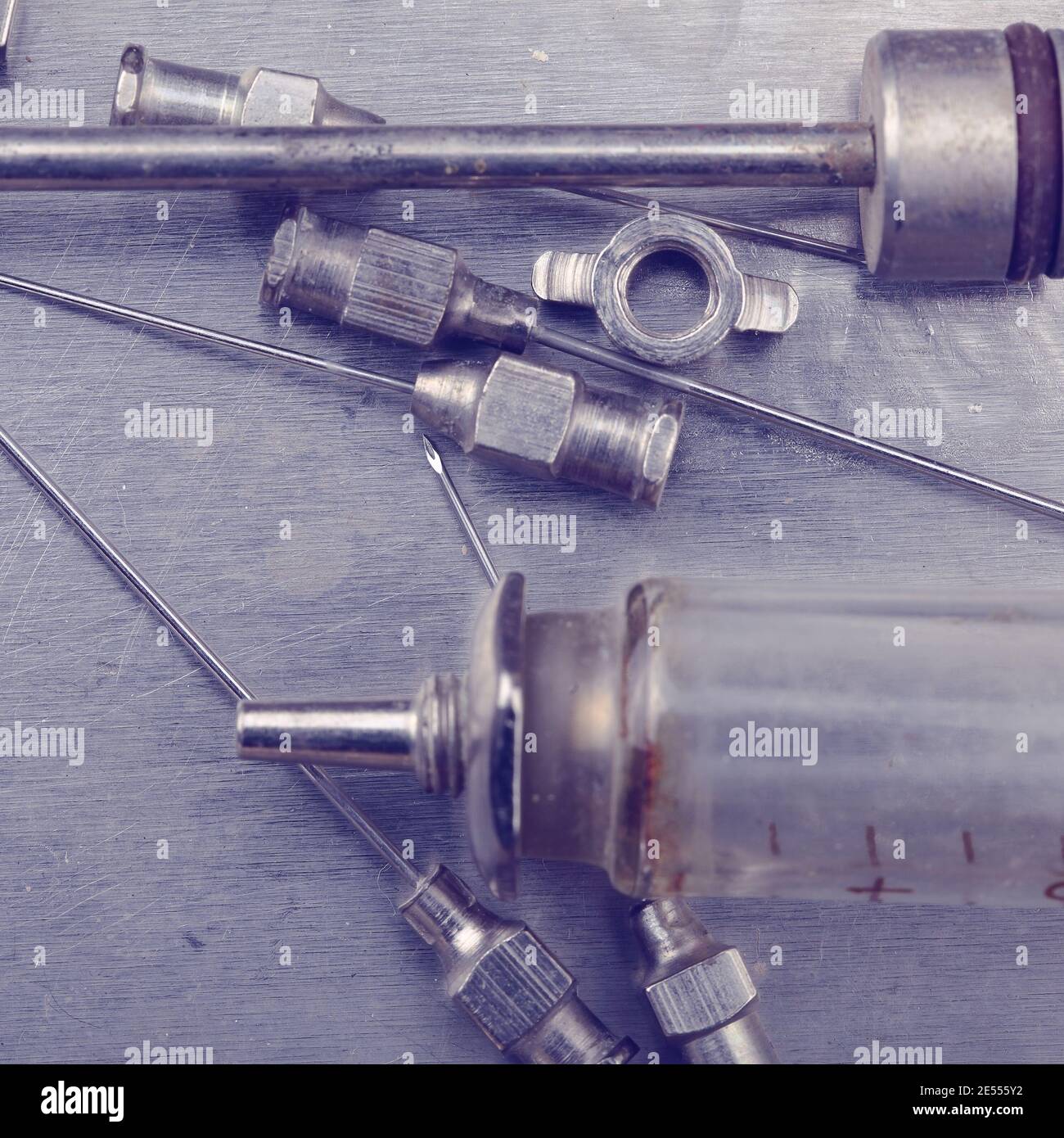 Parts of old medical syringe. Stock Photo