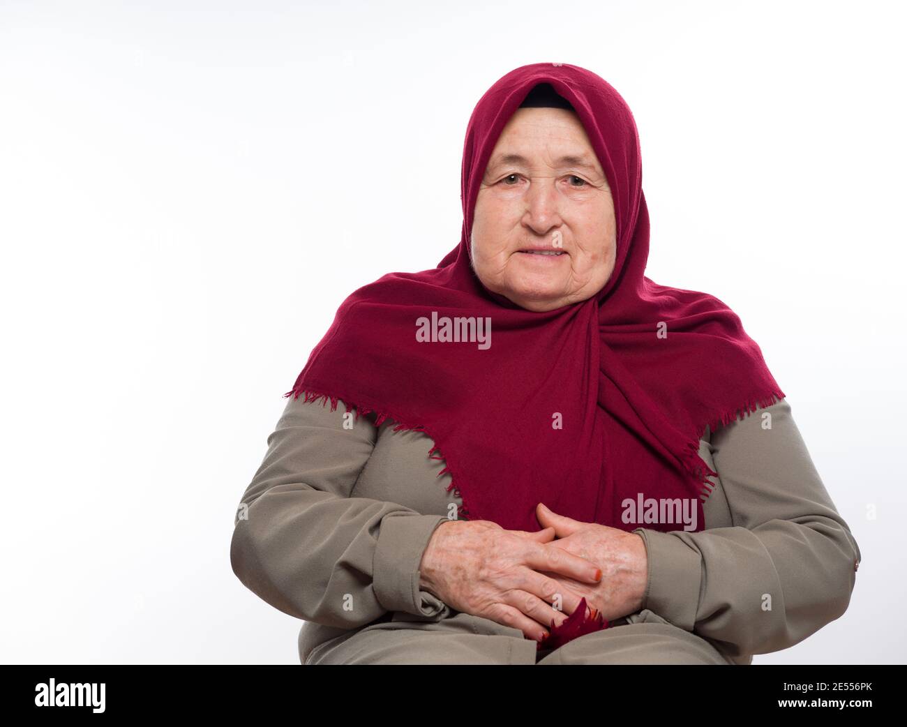 Old Turkish woman. Old lady in Muslim clothes. Stock Photo