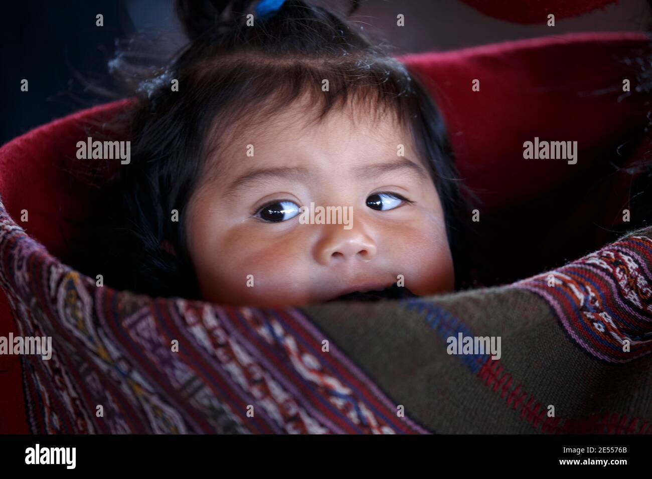 Quechua baby girl, Balcon del Inka weavers cooperative, Chinchero, Cusco, Peru Stock Photo
