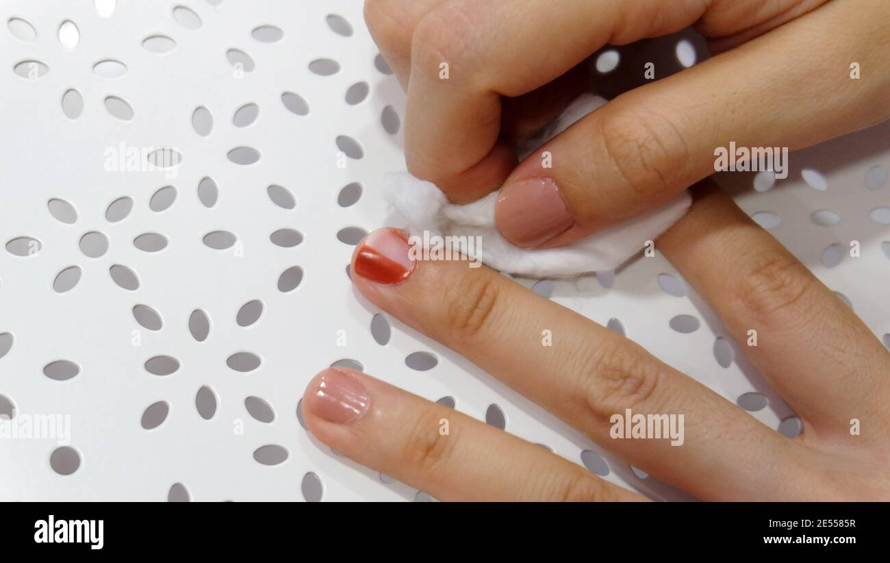 Hand rubbing off red nail polish from fingernails with white cotton Stock Photo - Alamy Hand rubbing off red nail polish from fingernails with white cotton Stock Photo - Alamy