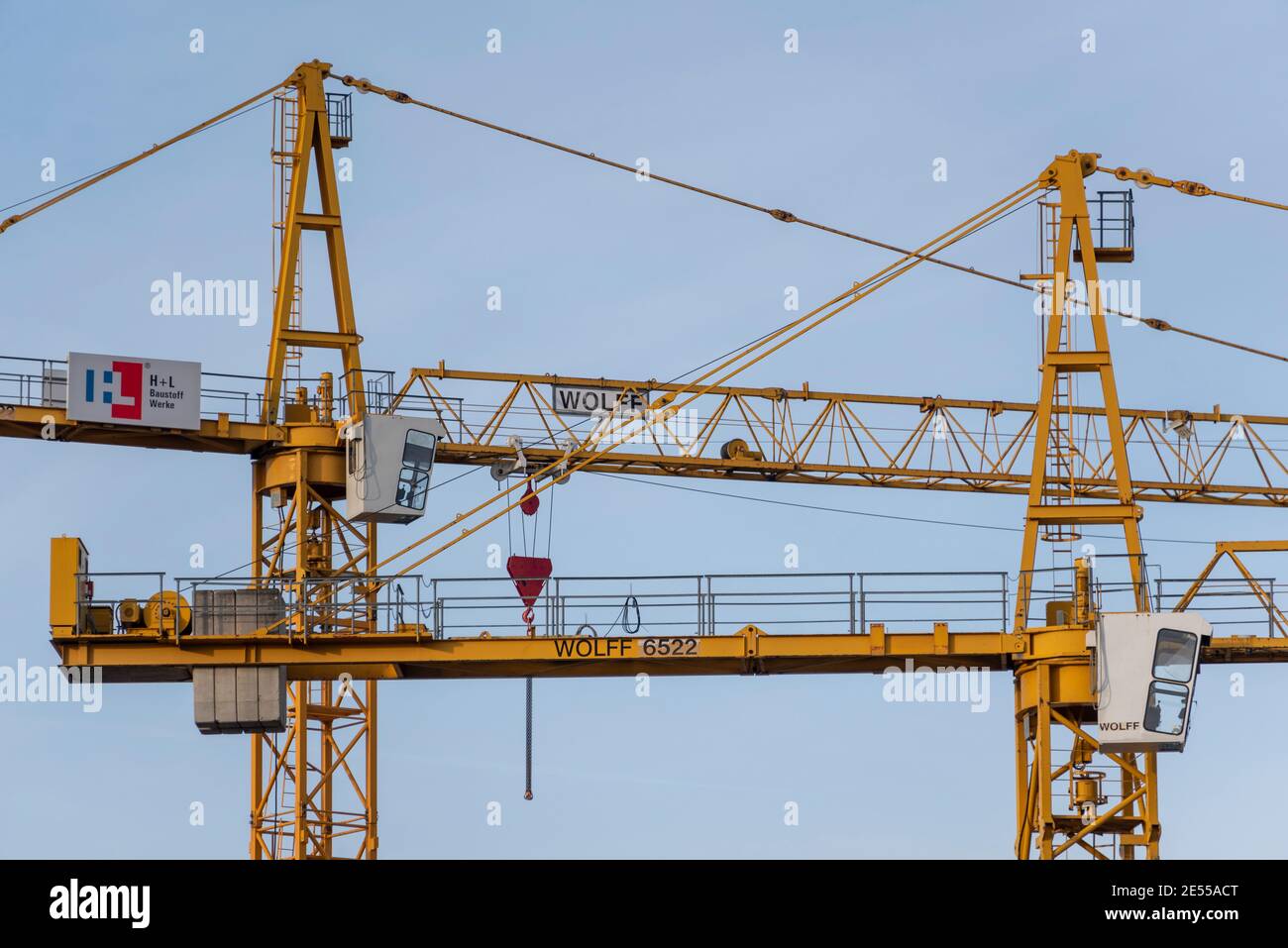 Magdeburg, Germany. 23rd Jan, 2021. Yellow construction cranes stand in the  Neustadt district and reach into the sky. Credit: Stephan  Schulz/dpa-Zentralbild/ZB/dpa/Alamy Live News Stock Photo - Alamy