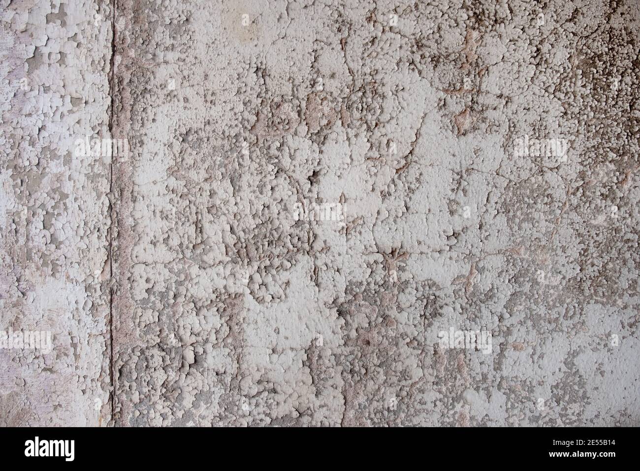 Texture with old, used, cracked painting, paint gray monochrome peeled off. Grunge color results in a free abstract pattern background texture Stock Photo