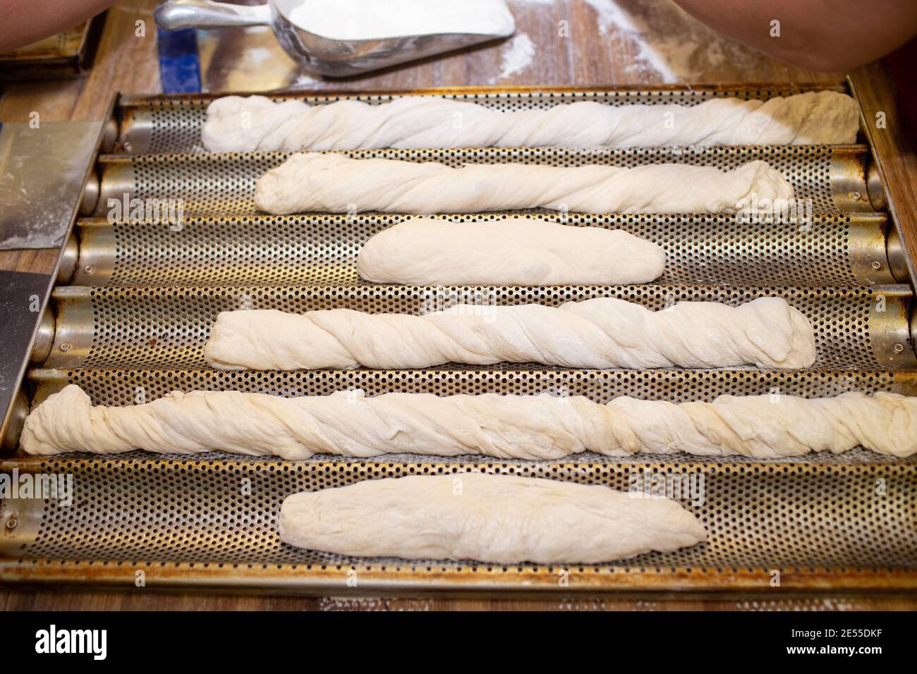 Bread baking process. forming a baguette French roll Stock Photo Alamy